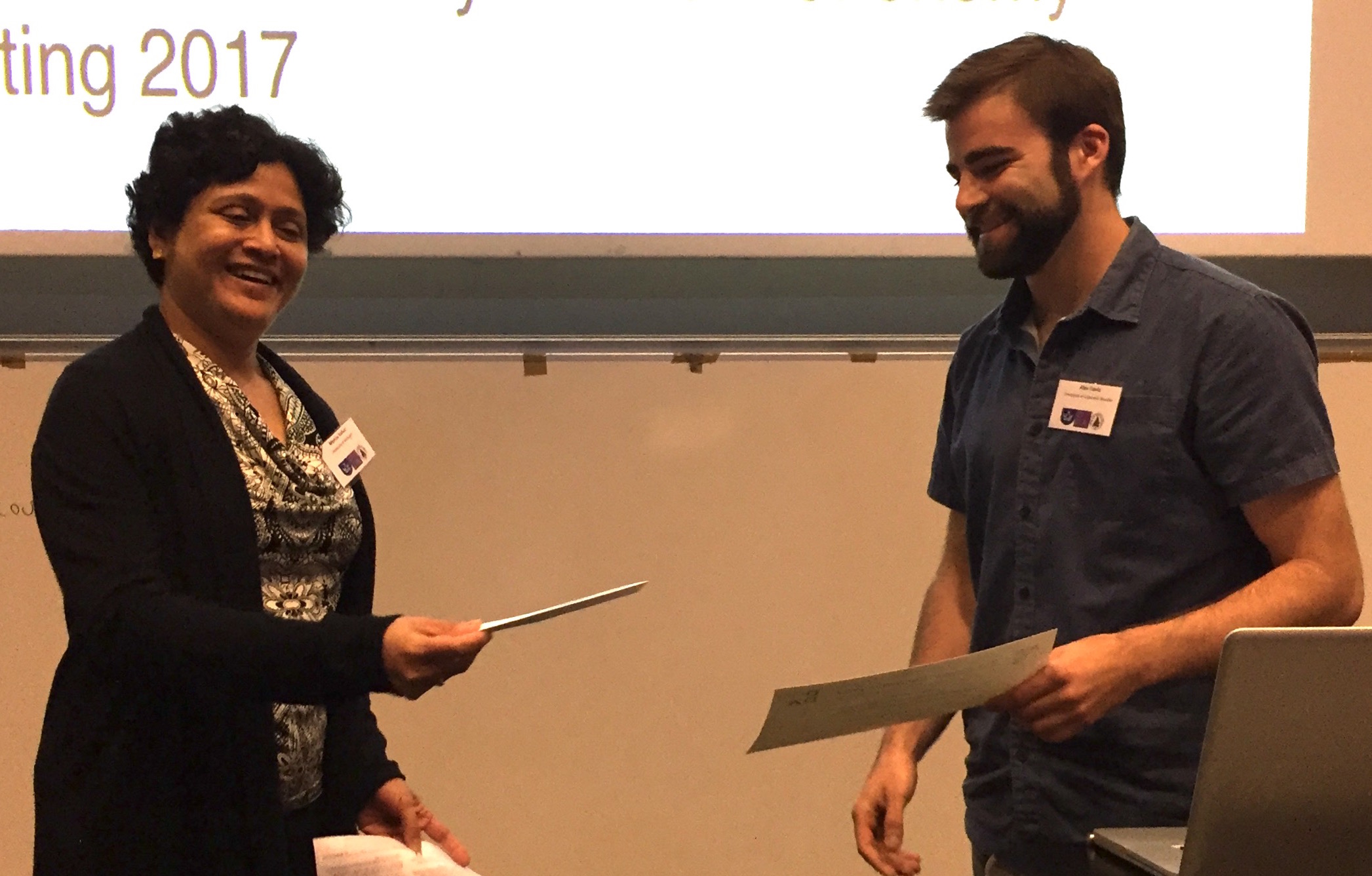 Alex Davis receives his award from DDA Chair Monica Valluri